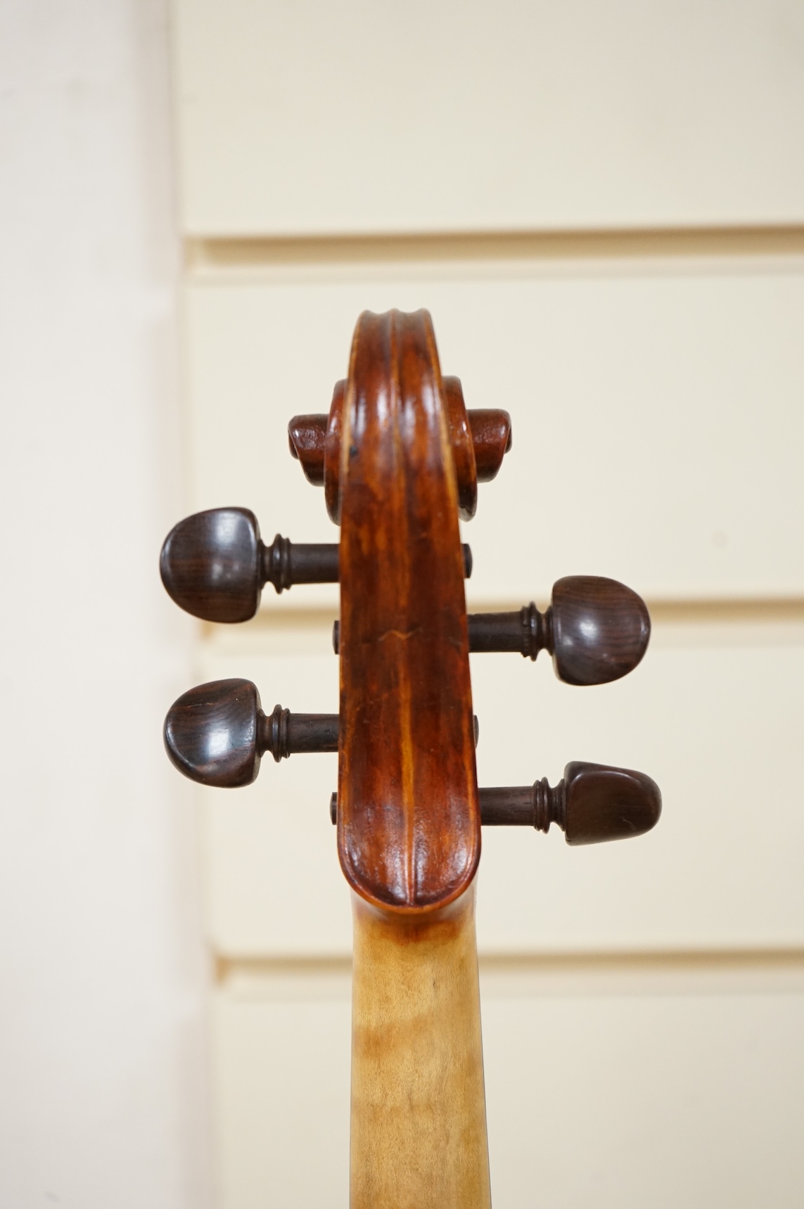 Three violins; a late 19th century German Stradivarius pattern violin, without label, a handmade violin (a.f.), with sound post crack, broken and repaired scroll, etc. and a Maidstone violin body, varnish stripped from t